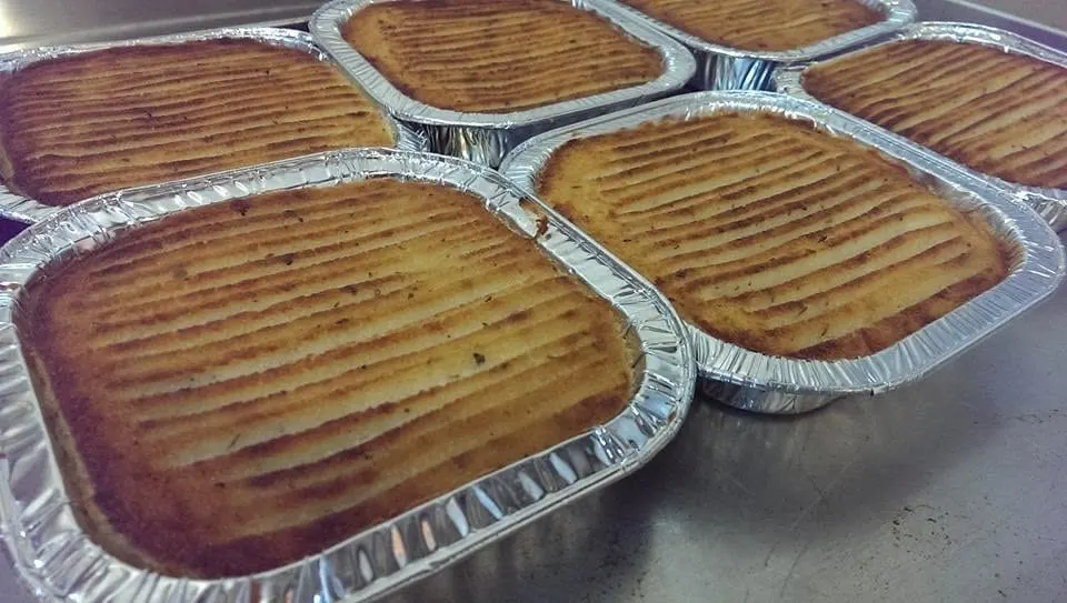 Single-serving shepherd’s pies in foil trays, with golden ridged mash on top